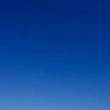 Clear sky as gradient or background. Azure sky without clouds. Stockfoto's