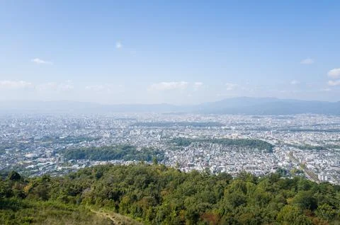 Clear sky panoramic view over Kyoto from hillside Stock Photos
