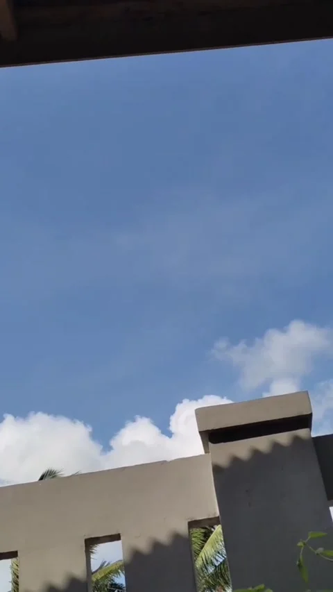 The clear sky is the perfect backdrop for gently rolling clouds Stock Footage 227945155