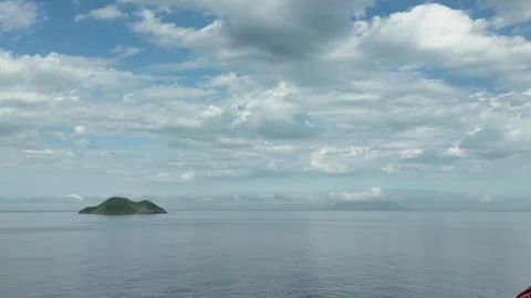 Clear Sky with Soft Clouds Over the Ocean Stock Footage 298279184