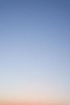 Clear sky without clouds, sunset. Sky background or gradient. Stock Photos