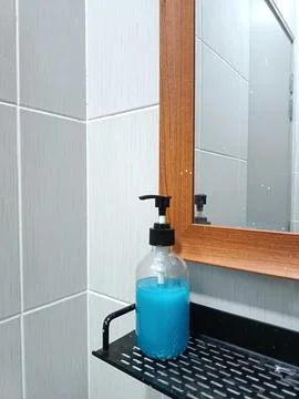 A clear soap dispenser Stock Photos