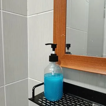 A clear soap dispenser Stock Photos
