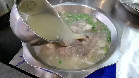 Clear soup beef hot pot to add soup upgrade slow action Stock Footage 161871403