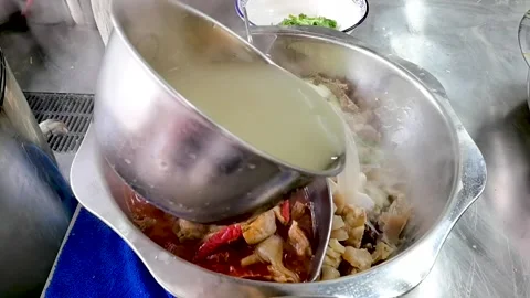 Clear soup beef hot pot to add soup upgrade slow action Stock Footage 161871550