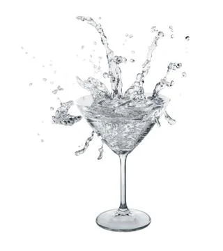 Clear splashes in martini glass. Stock Photos