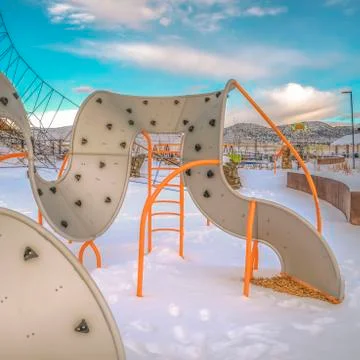 Clear Square Climbing frames on a playground with the ground covered with snow Stock Photos