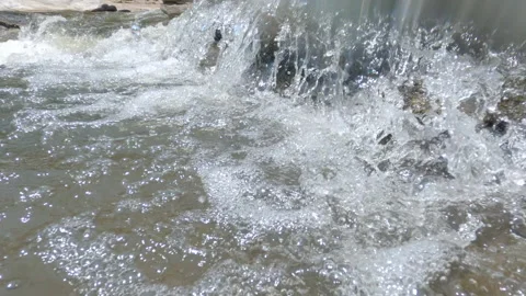 Clear stream running fast on stones covered with moss in national park.Waterfall Stock Footage 139269541