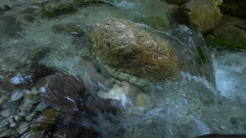 Clear stream running through stone boulders in carpathians. Abundant river Video stock 175116337