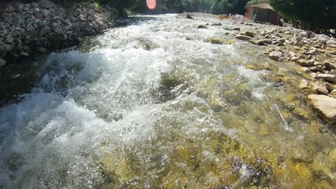 Clear stream running through stone boulders in Caucasus, Georgia Stock Footage 204869717