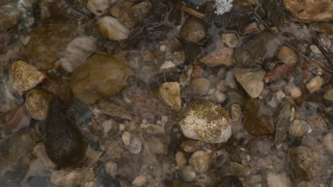 Clear stream running through stone Stock Footage 258296565