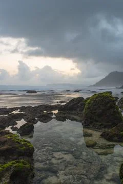 A clear tide pool on the beach in the cloudy afternoon Foto stock