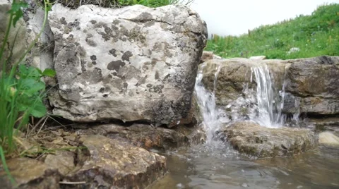 Clear Transparent Water Flows in the Mountain Small River Video stock 66276066