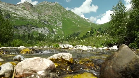 Clear Transparent Water Flows in the Mountain Small River Video stock 66276599