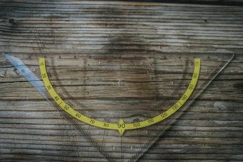 Clear triangular set square with ruler markings. Stock Photos