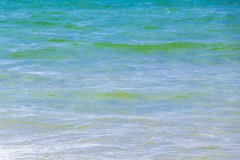 Clear turquoise blue waves wave and water texture Thailand beach. Photos