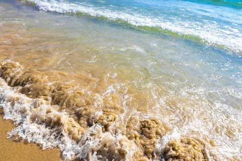 Clear turquoise blue waves wave water and beach sand Thailand. Stock-Fotos