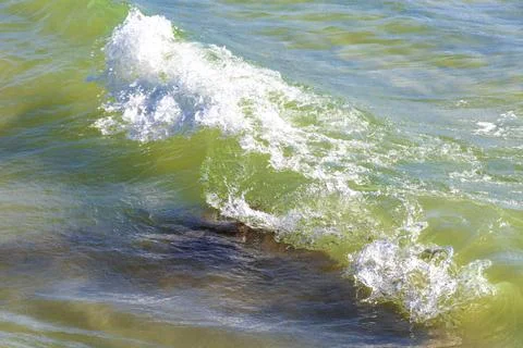 Clear turquoise blue waves wave water and beach sand Thailand. Stock Photos
