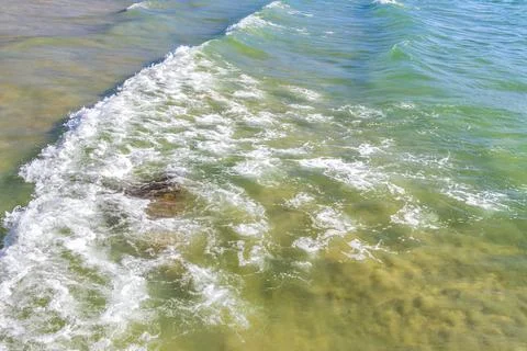 Clear turquoise blue waves wave water and beach sand Thailand. 写真素材