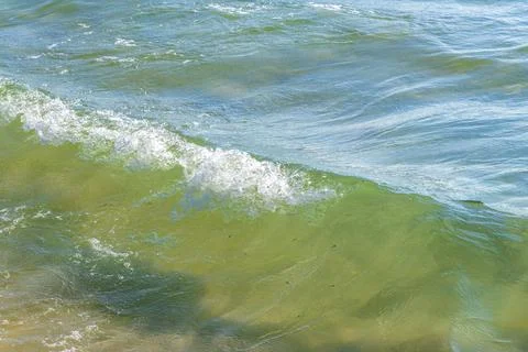 Clear turquoise blue waves wave water and beach sand Thailand. 写真素材