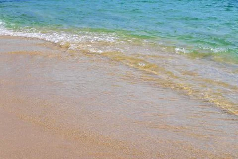 Clear turquoise blue waves wave water and beach sand Thailand. 스톡 사진