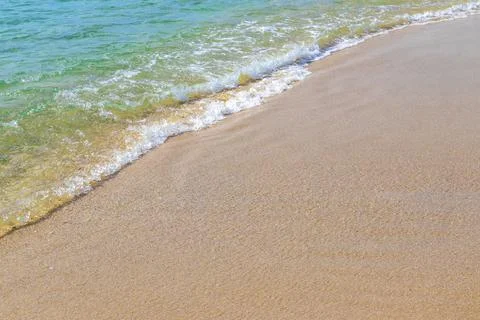 Clear turquoise blue waves wave water and beach sand Thailand. Stock Photos