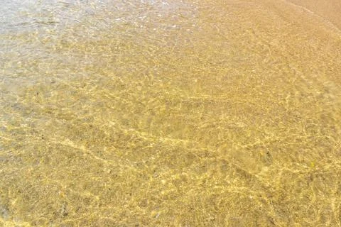 Clear turquoise blue waves wave water and beach sand Thailand. 写真素材