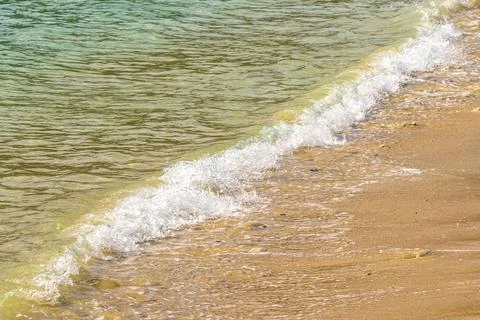 Clear turquoise blue waves wave water and beach sand Thailand. 스톡 사진