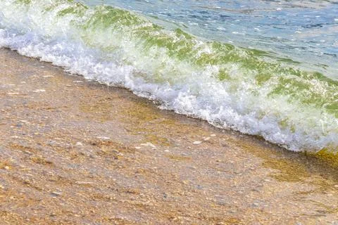 Clear turquoise blue waves wave water and beach sand Thailand. 写真素材