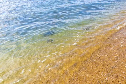 Clear turquoise blue waves wave water and beach sand Thailand. 写真素材