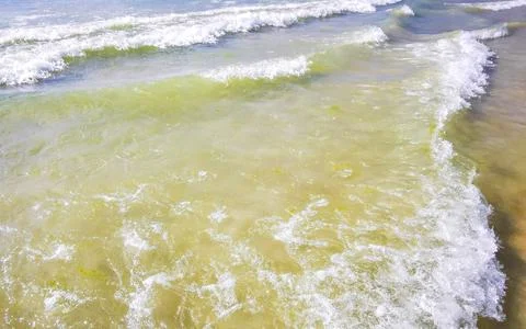 Clear turquoise blue waves wave water and beach sand Thailand. Stock Photos