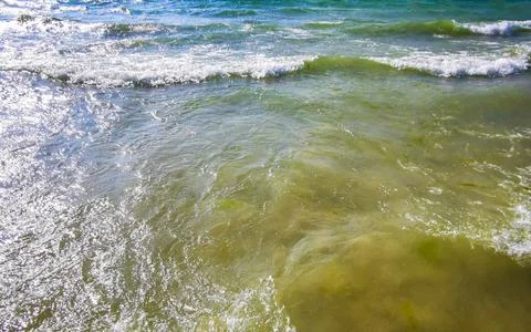 Clear turquoise blue waves wave water and beach sand Thailand. Stock Photos