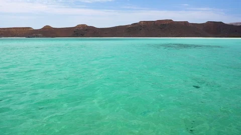Clear turquoise waters on an isolated beach in the Sea of Cortez. Stock Footage 107228133