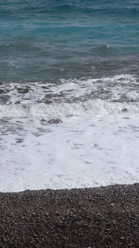 Clear Turquoise Waves Rolling Onto Pebble Beach Shoreline Stock Footage 346252630