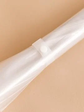 Clear umbrella closed snap button detail Stock Photos