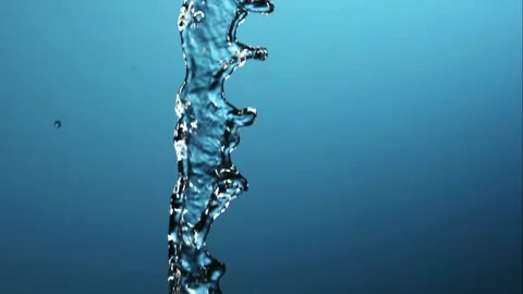 Clear vertical water stream falling and splashing Stock Footage 327052369