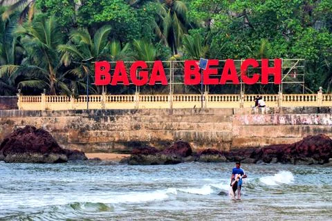 A clear view of the BAGA BEACH signboard placed along the beachside Stock Photos