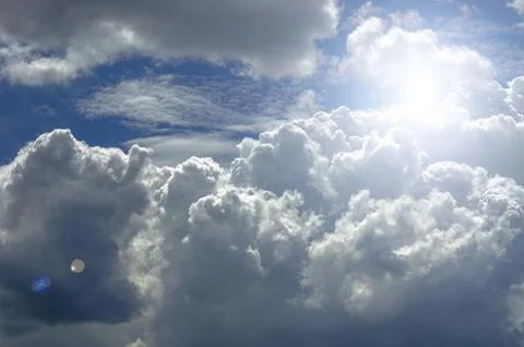 Clear view of cumulus clouds under bright sunlight showing natural beauty a.. Stock Photos