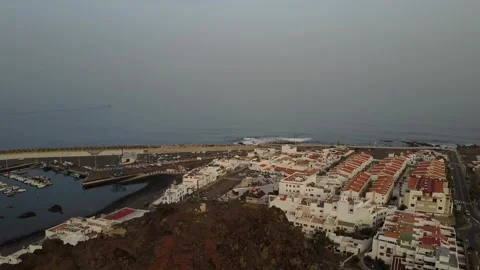Clear view of a large rock in front of a port in the Canary Islands Stock Footage 300553993