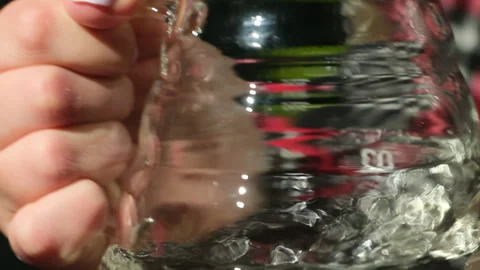 Clear viscous liquid clings inside glass measuring cup Stock Footage 306592197