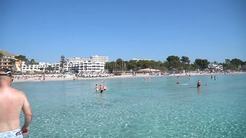 Clear water beach slow motion Stock Footage 128351661
