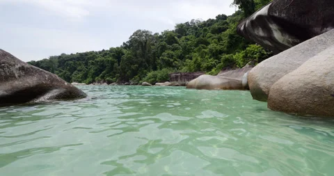 Clear water between large rocks, POV camera move forward Stock Footage 314637912