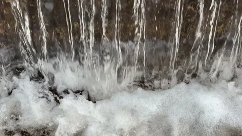 Clear water cascading down creating thick white foam curtains Stock Footage 346012890