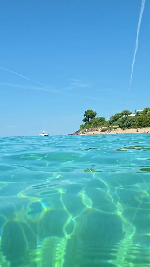 Clear water dances gently under sunlight. Lagomandra, Greece. Vertical Stock Footage 339627032