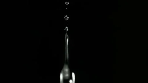 Clear Water Droplet Falling In Slow Motion On Black Background Stock Footage 339301304