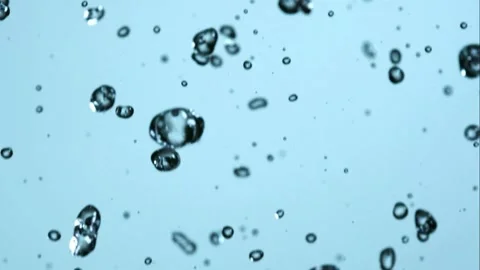 Clear water droplets falling through the air Stock Footage 327120570