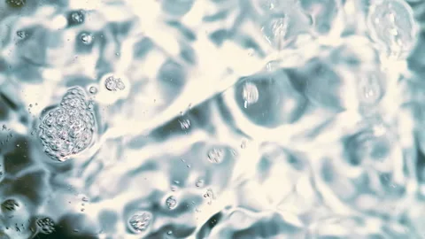 Clear Water Flow Macro  Transparent Rippling Stream Bubbles Close-Up Stock Footage 331839678