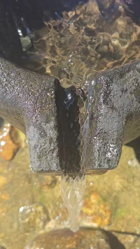 Clear Water Flowing Down from Rocky Pool in Nature Stock Footage 336346453
