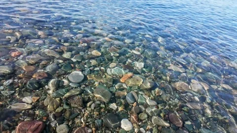 Clear Water Flowing Over Pebble Shore Stock Footage 341498326