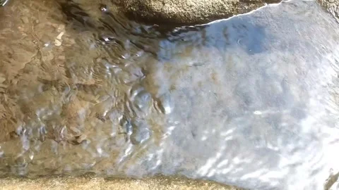 Clear Water Flowing Over River Rocks 스톡 동영상 334836638
